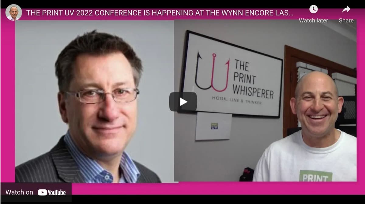 Video frame pairing a portrait of Gary Doman with Warren Werbitt beneath a The Print Whisperer sign