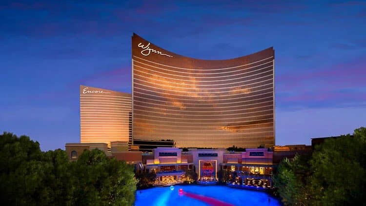Curved bronze glass towers of the Wynn and Encore resort in Las Vegas at dusk